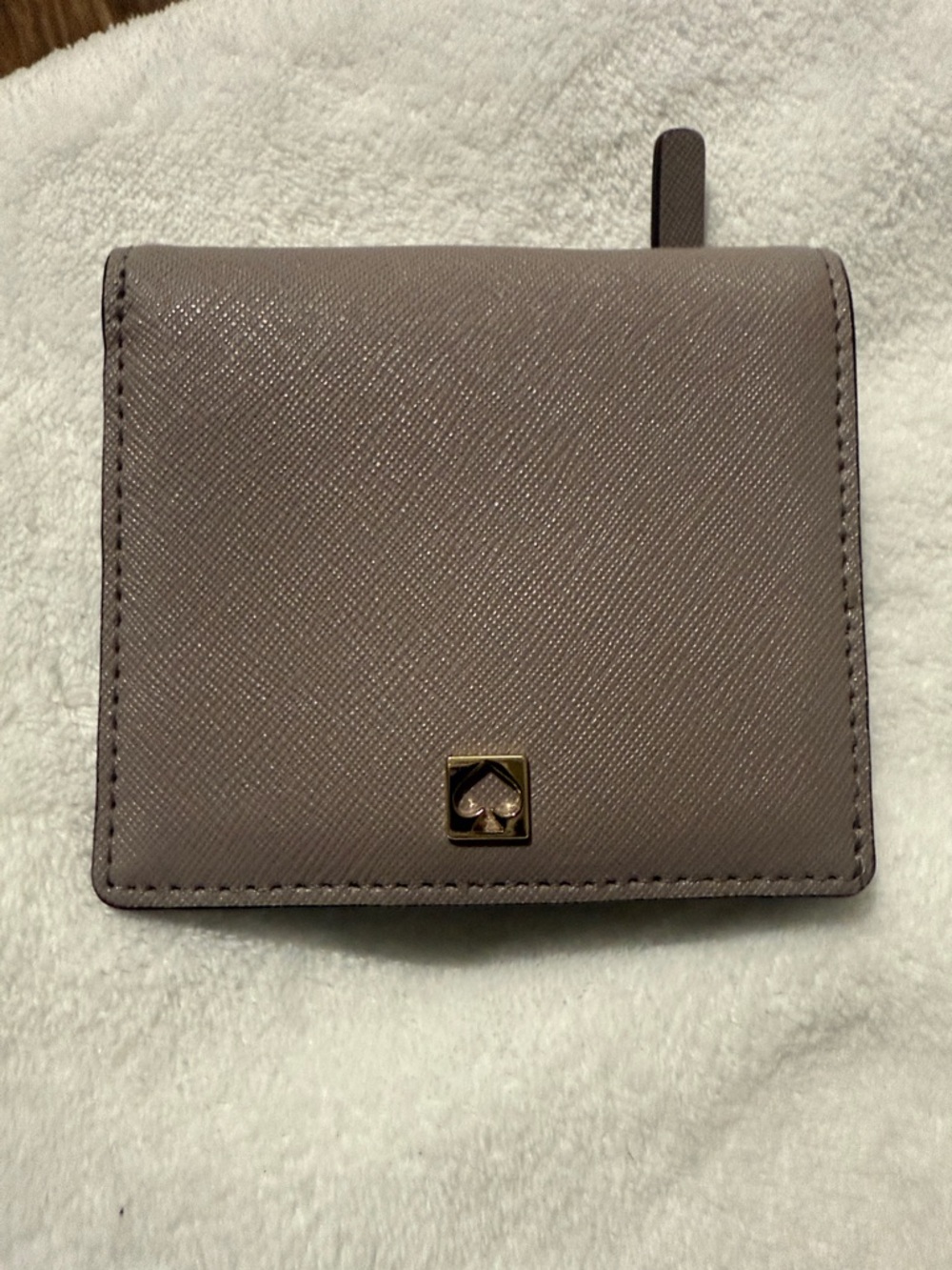kate spade mauve taupe saffiano bifold wallet with gold spade emblem